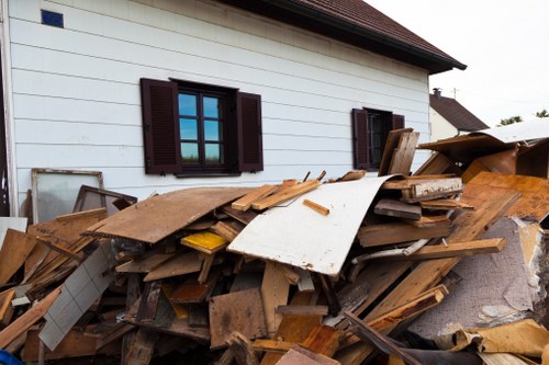 Professionals clearing a loft space in Acton